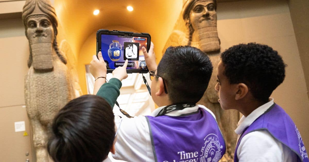 Young woman visitor using phone in the historical museum Matilda The Musical Logo